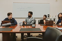 panelists sitting behind long table during workshop discussion