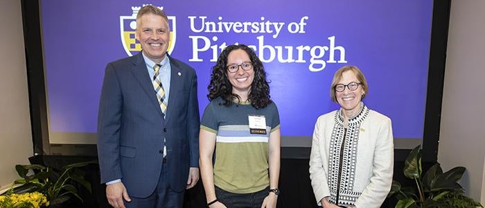 Grad Student Honors Convocation awardee with provost and chancellor