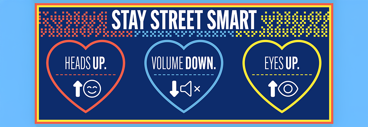 Illustrations of hearts that read "Heads Up, Volume Down, Eyes Up" under a header that says "Stay Street Smart."