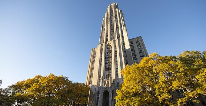 Cathedral of Learning behind fall trees