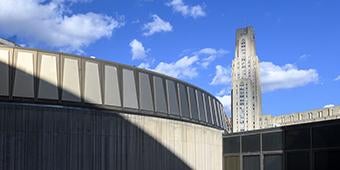 campus buildings against blue sky