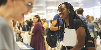 student attendng graduate student resource fair