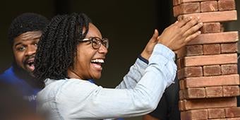 grad student playing game at grad student orientation picnic