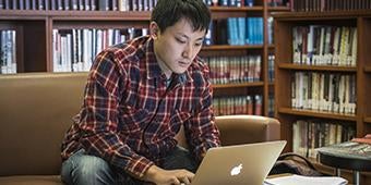 pitt law student studying in library