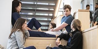 students relax in Scaife Hall lounge area