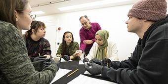 Instructor interacting with student sduring Art and Architecture class